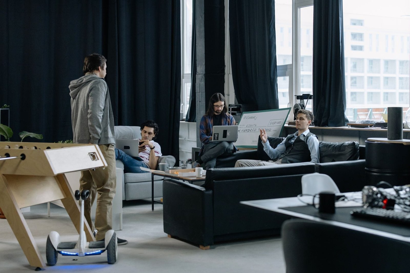 Modern co-working office space in a UAE free zone building with professionals working at desks