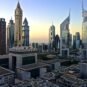 Emirates Towers in Dubai at dawn, representing UAE corporate tax registration deadlines and the AED 10,000 late-registration penalty for free zone companies