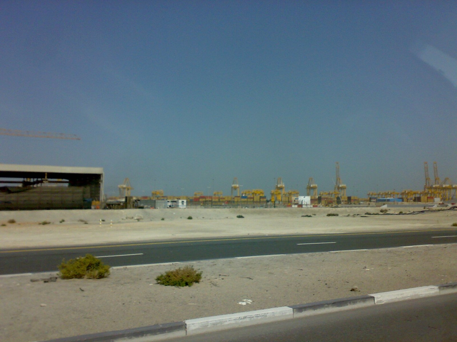 Container terminal at Port Jebel Ali free zone, Dubai, illustrating designated zone goods movements and UAE VAT bad debt relief